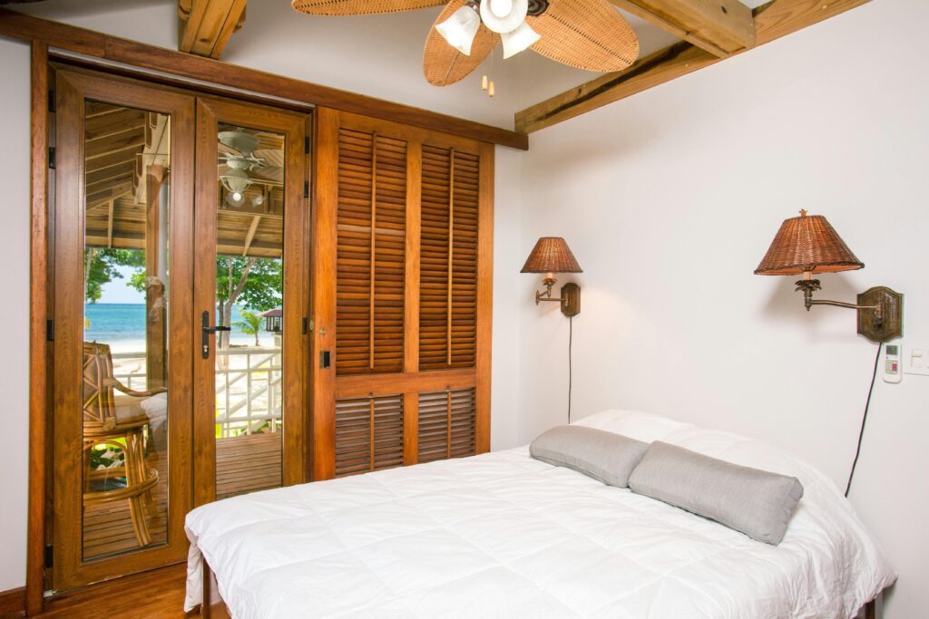 A serene beachfront bedroom with modern design and ocean view.